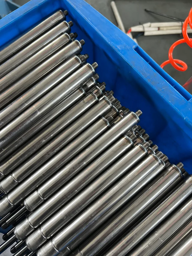 Finished gas spring units in a handling bin