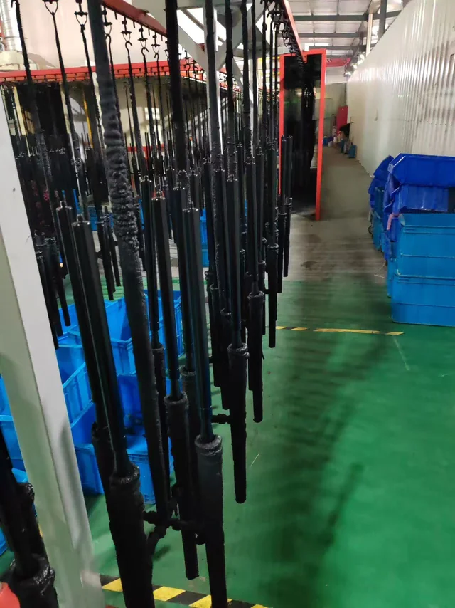 Coated cylinders on hanging carriers
